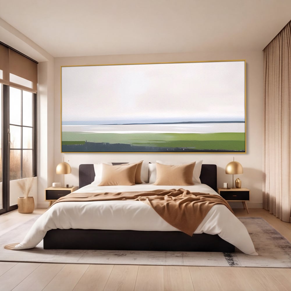 Tablou canvas cu pictura orizontala cu peisaj de campie si apa, in rama de aluminiu auriu, pe perete intr-un dormitor